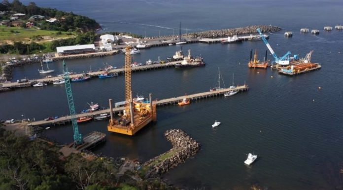 Cranes and barges signal commencement of Eden wave attenuator construction – About Regional